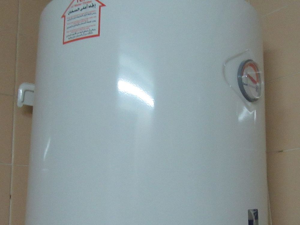 Storage water heater mounted on the wall — electric water heaters for every bathroom